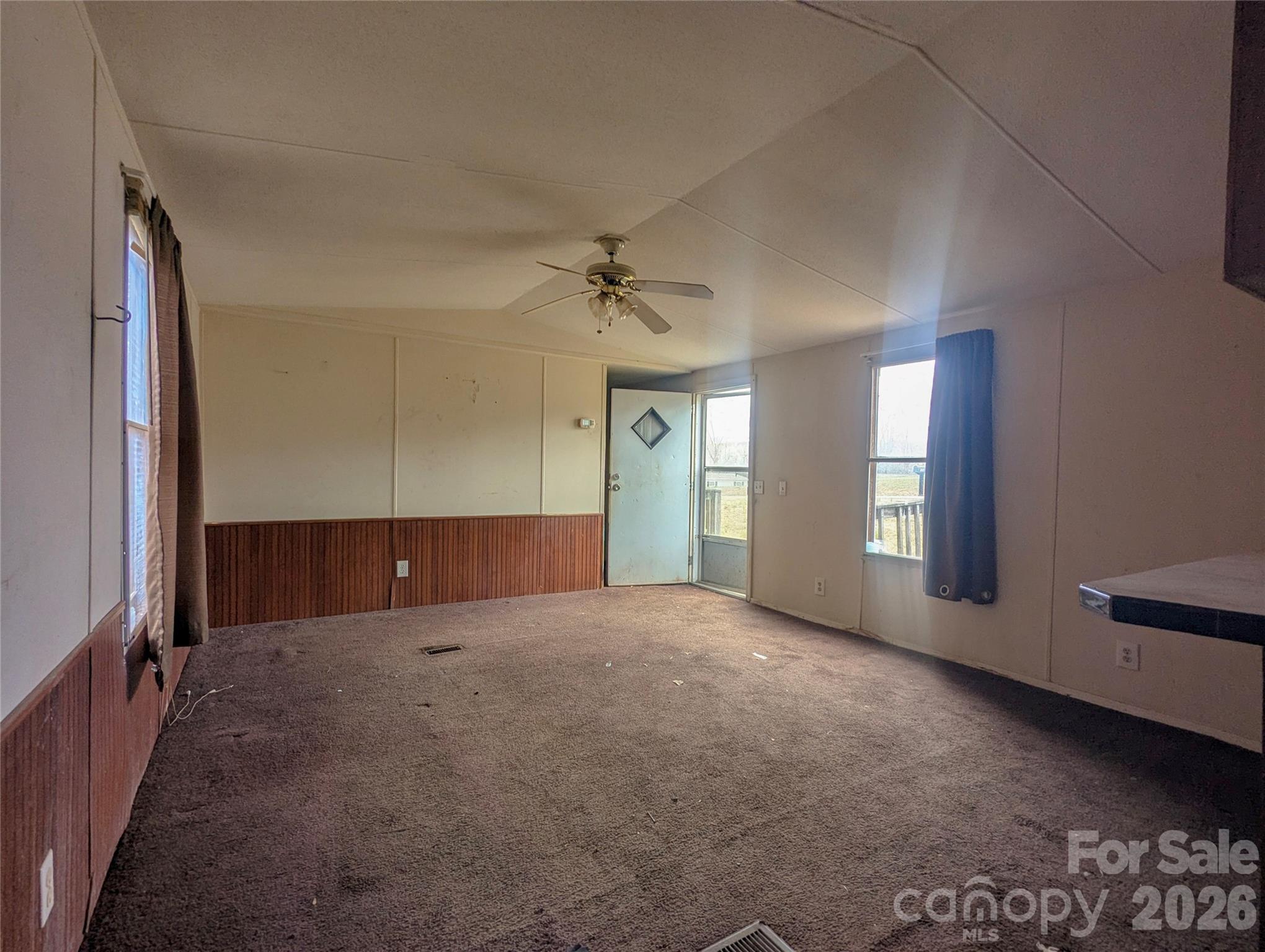 565 Jm Lovelace Road Ellenboro, NC 28040 - Photo 10 of 42 wooden floor in an empty room with a window