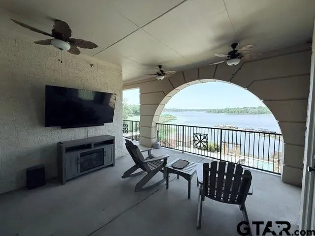 a view of a livingroom with furniture and a flat screen tv