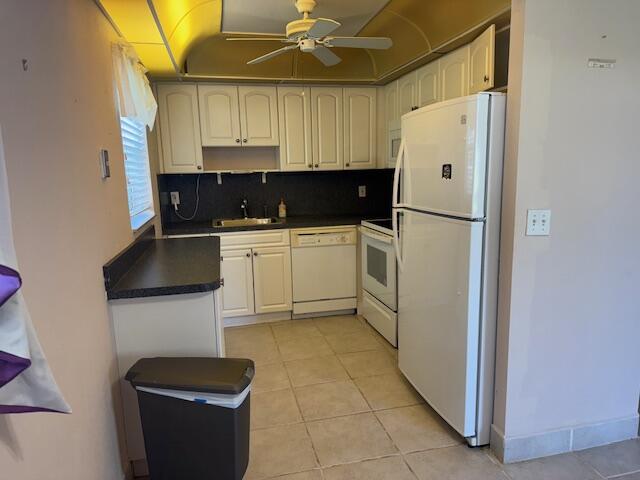 349 Flanders South Delray Beach, FL 33484 - Photo 1 of 26 a kitchen with a refrigerator and a stove top oven