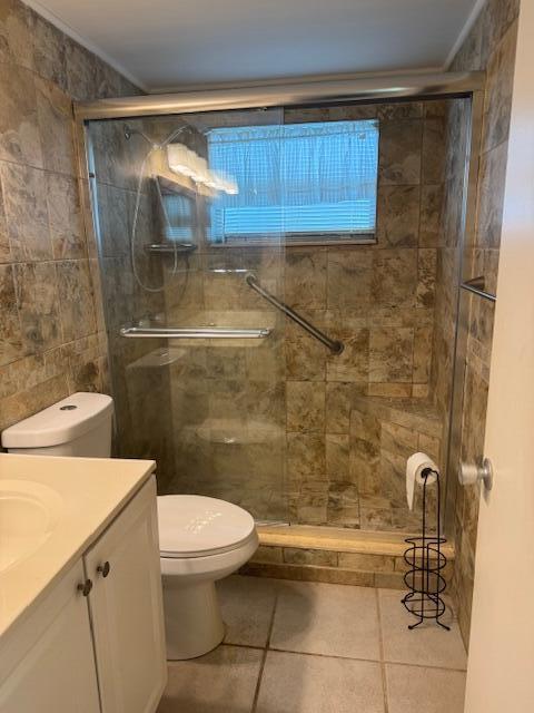 349 Flanders South Delray Beach, FL 33484 - Photo 13 of 26 a bathroom with a toilet and a shower