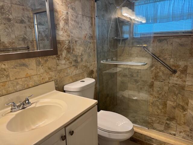 349 Flanders South Delray Beach, FL 33484 - Photo 16 of 26 a bathroom with a sink a toilet and shower