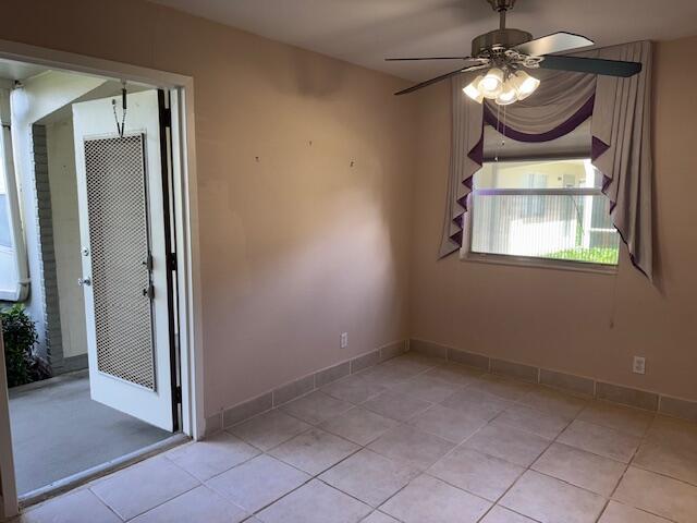 349 Flanders South Delray Beach, FL 33484 - Photo 4 of 26 an empty room with a mirror and a fan