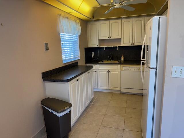 349 Flanders South Delray Beach, FL 33484 - Photo 6 of 26 a kitchen with stainless steel appliances a stove a sink and a refrigerator