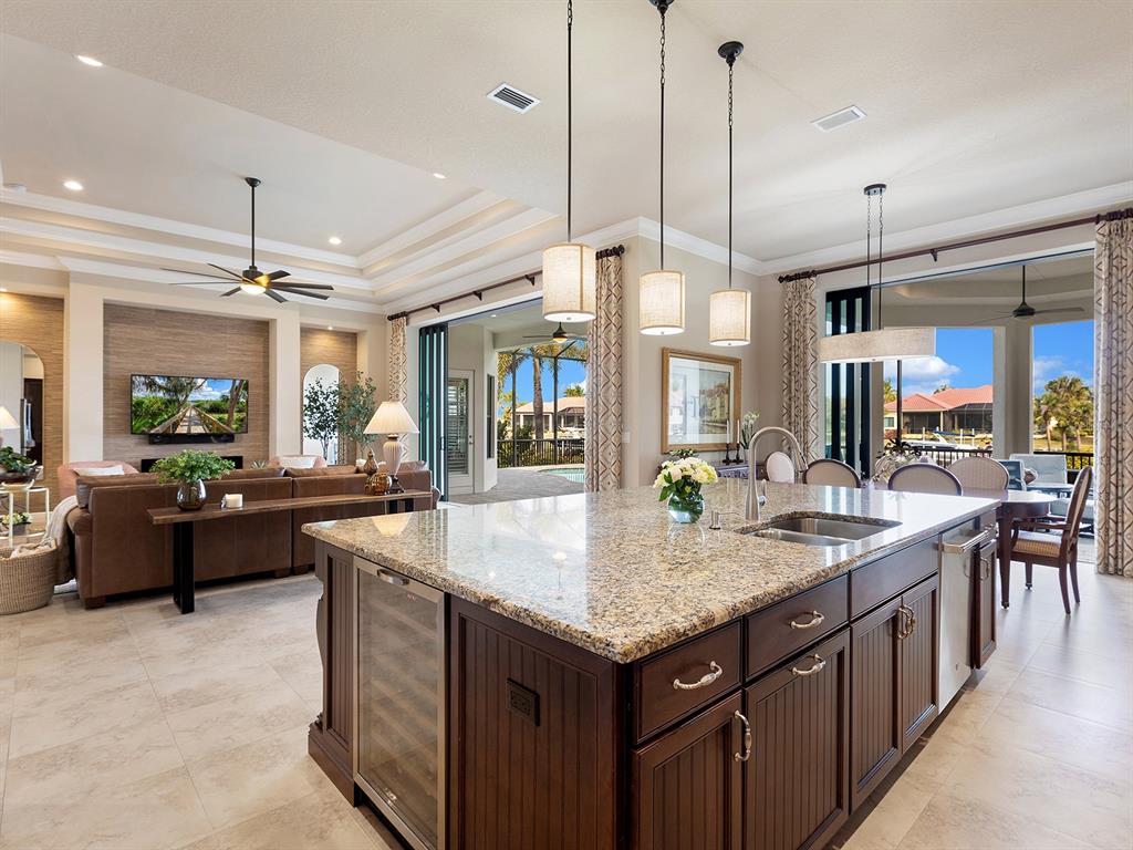11708 Rive Isle Run Parrish, FL 34219 - Photo 14 of 65 a kitchen with granite countertop a sink and a stove