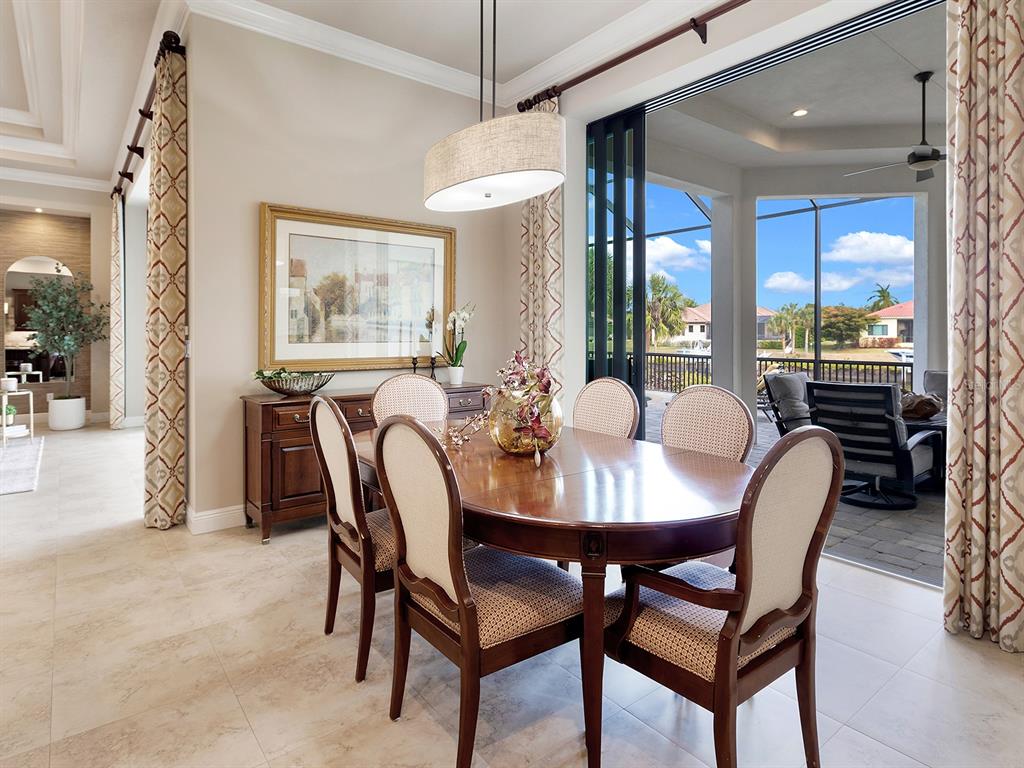 11708 Rive Isle Run Parrish, FL 34219 - Photo 15 of 65 a view of a dining room with furniture window and outside view
