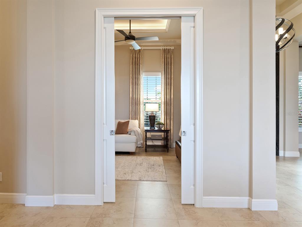 11708 Rive Isle Run Parrish, FL 34219 - Photo 17 of 65 a view of a bedroom with a bed and a window