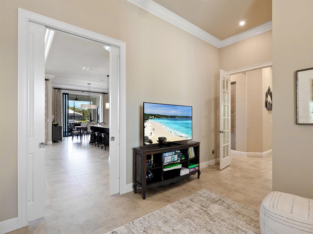 11708 Rive Isle Run Parrish, FL 34219 - Photo 20 of 65 a living room with furniture and a flat screen tv