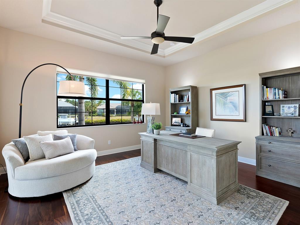11708 Rive Isle Run Parrish, FL 34219 - Photo 21 of 65 a living room with furniture and a large window