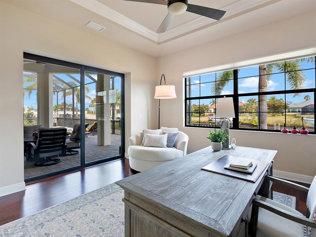 11708 Rive Isle Run Parrish, FL 34219 - Photo 22 of 65 a living room with furniture and wooden floor