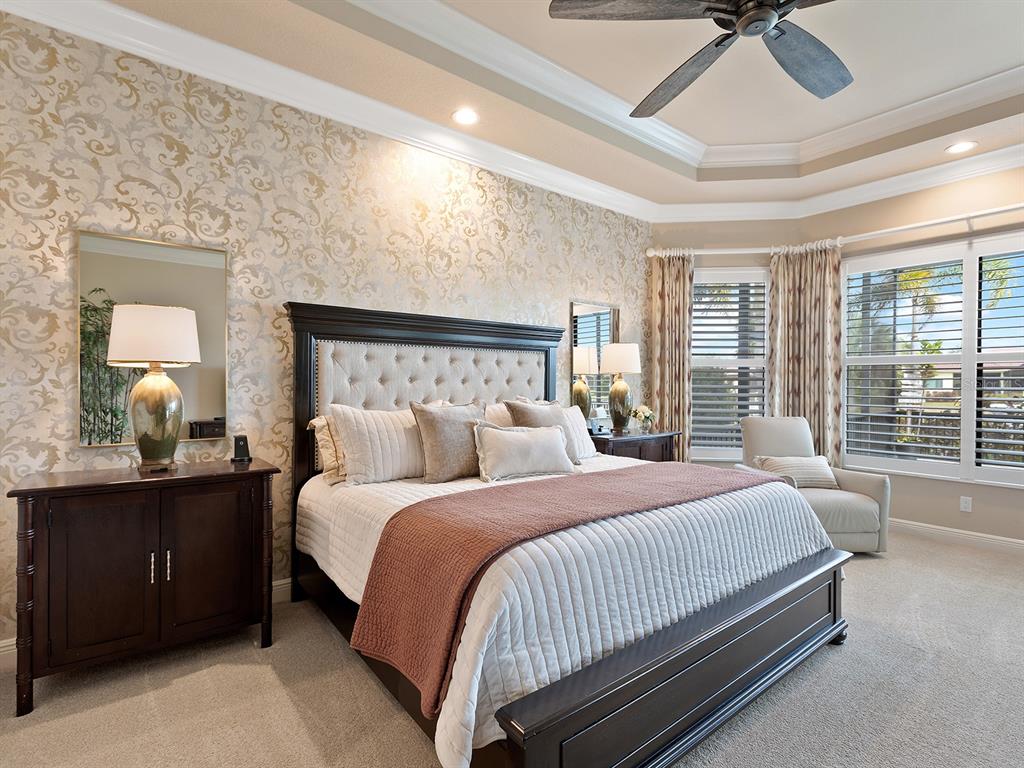 11708 Rive Isle Run Parrish, FL 34219 - Photo 26 of 65 a bedroom with a bed and window