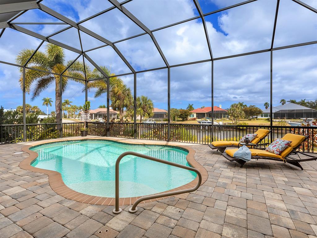 11708 Rive Isle Run Parrish, FL 34219 - Photo 39 of 65 a view of a swimming pool with a lounge chairs