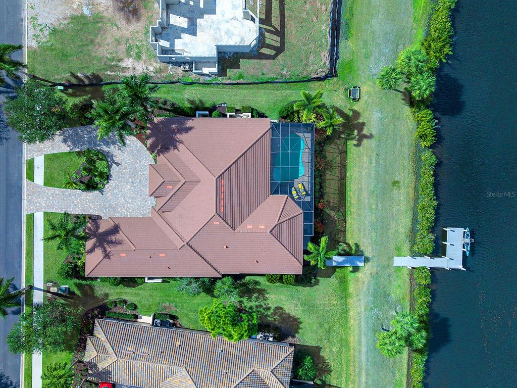 11708 Rive Isle Run Parrish, FL 34219 - Photo 45 of 65 an aerial view of house with yard swimming pool and outdoor seating