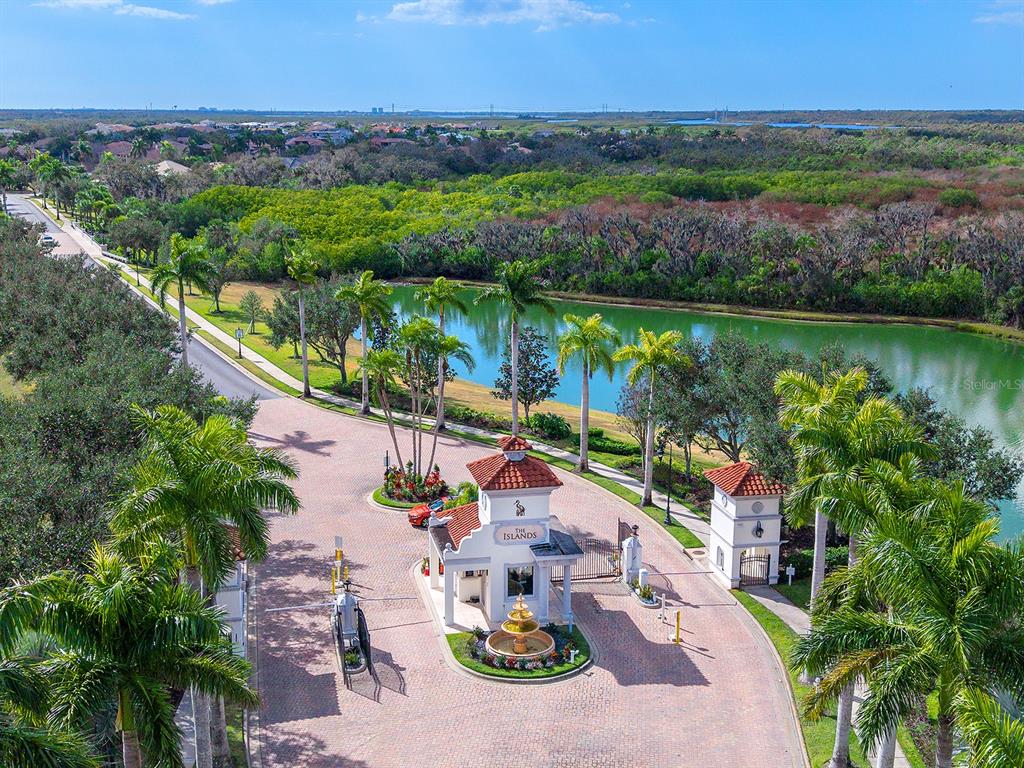11708 Rive Isle Run Parrish, FL 34219 - Photo 48 of 65 an aerial view of lake and residential houses with outdoor space