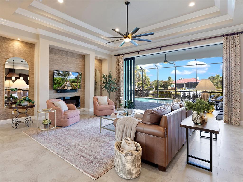11708 Rive Isle Run Parrish, FL 34219 - Photo 9 of 65 a living room with furniture and a large window