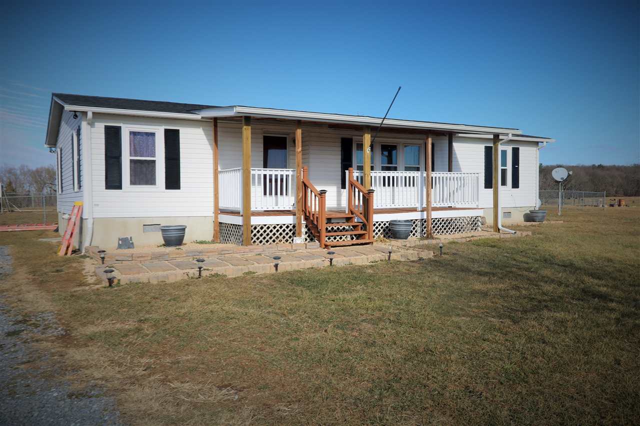 86 Middle Lane Road Grottoes, VA 24441 - Photo 1 of 50 a backyard of a house with seating space