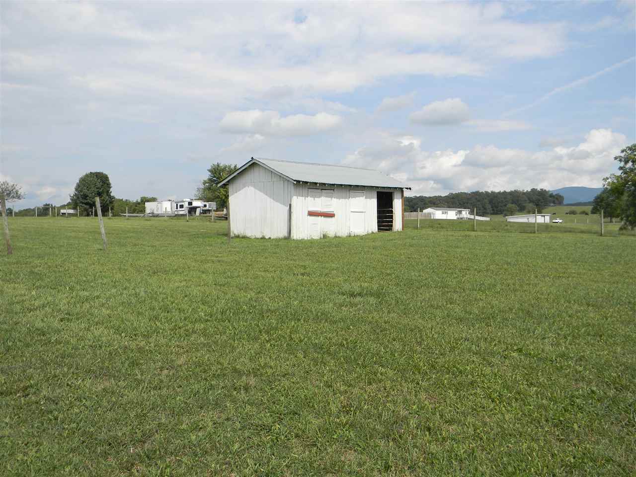 86 Middle Lane Road Grottoes, VA 24441 - Photo 21 of 50 a big yard with lots of green space and fog