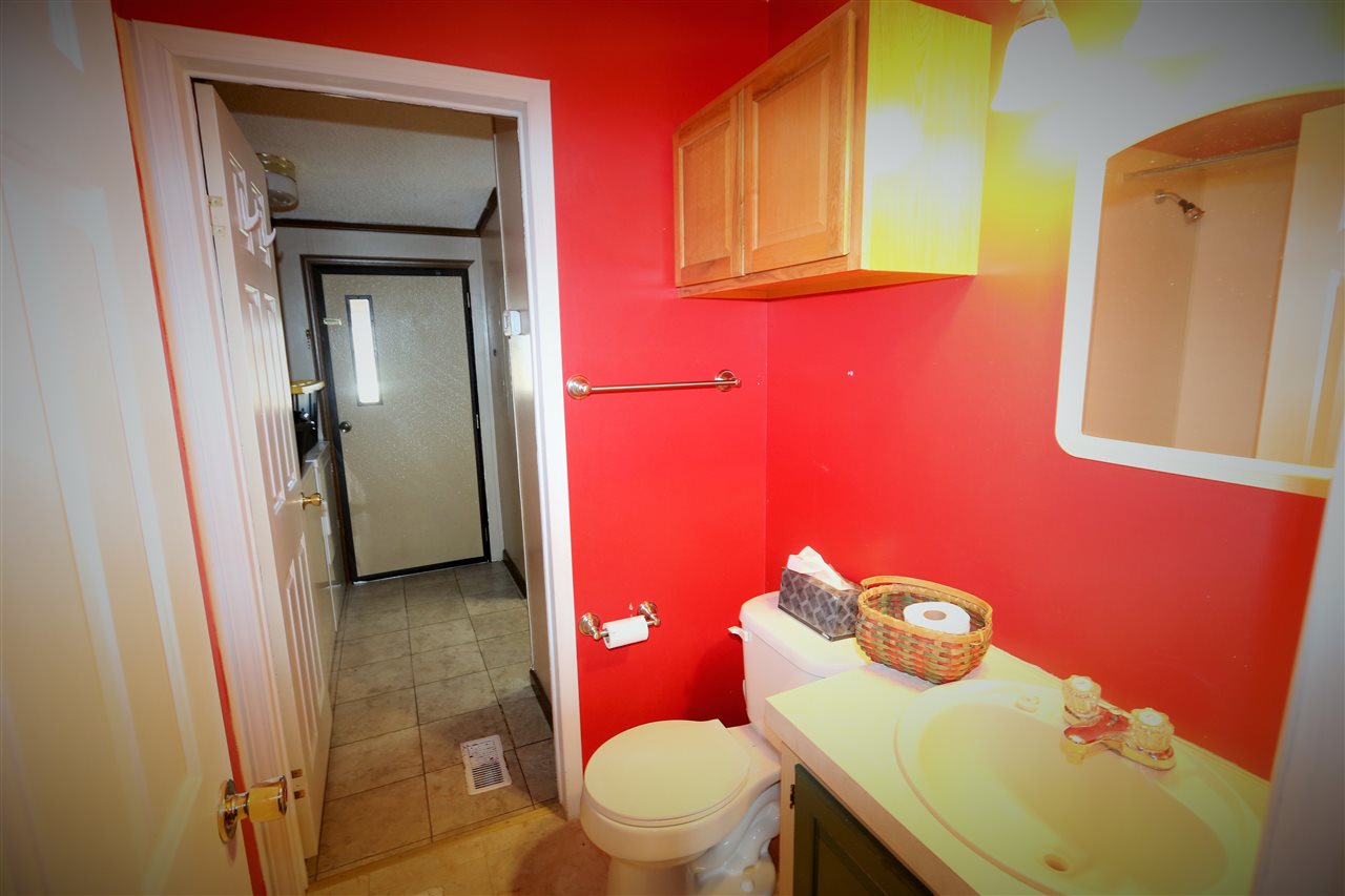 86 Middle Lane Road Grottoes, VA 24441 - Photo 46 of 50 a bathroom with a sink a toilet and mirror