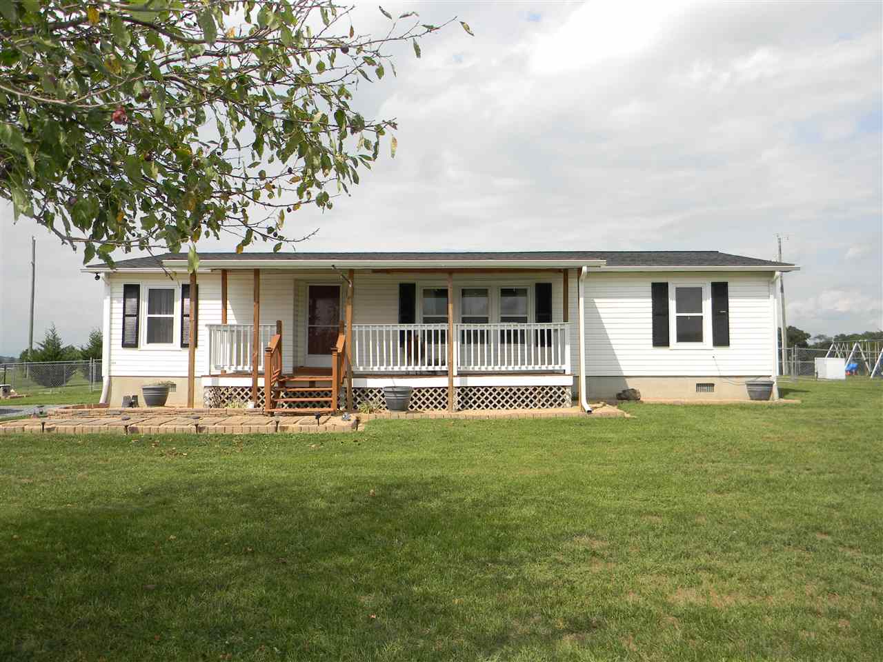 86 Middle Lane Road Grottoes, VA 24441 - Photo 5 of 50 a front view of a house with a garden