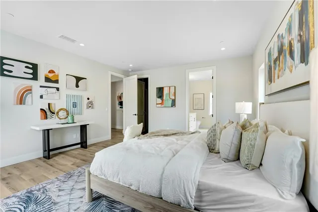 a bedroom with a bed and lamp