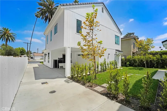 an aerial view of houses with outdoor space