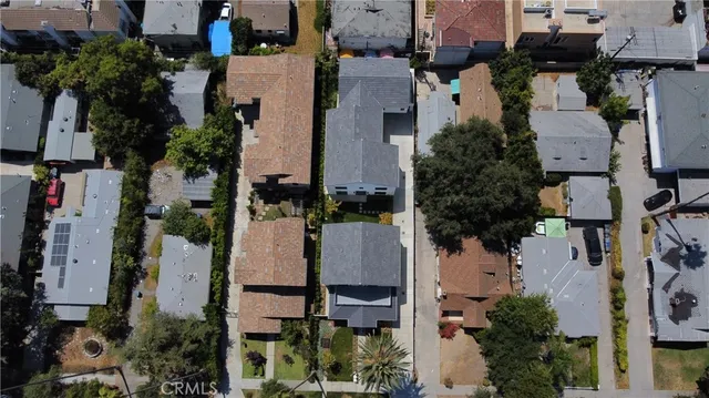 an aerial view of a house with a yard