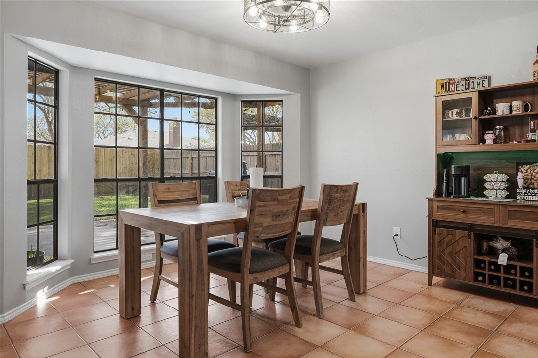 2169 Timberleaf Circle Ingleside, TX 78362 - Photo 11 of 36 a view of a dining room with furniture and a window