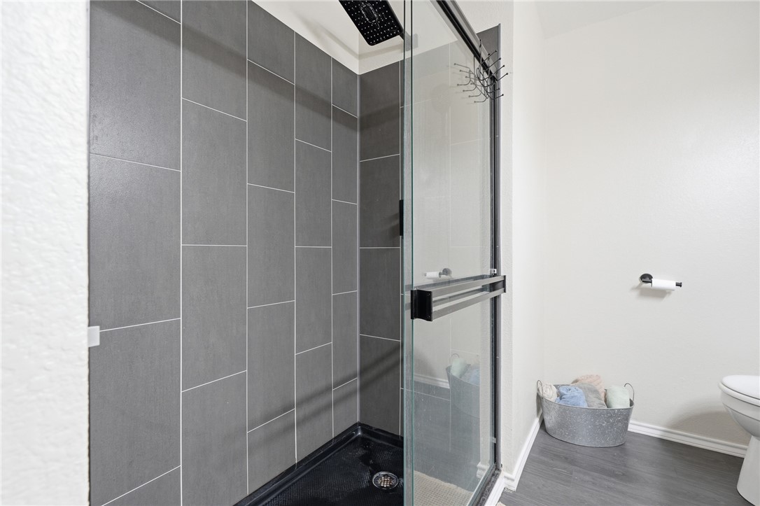 2169 Timberleaf Circle Ingleside, TX 78362 - Photo 19 of 36 a bathroom with a shower and a toilet