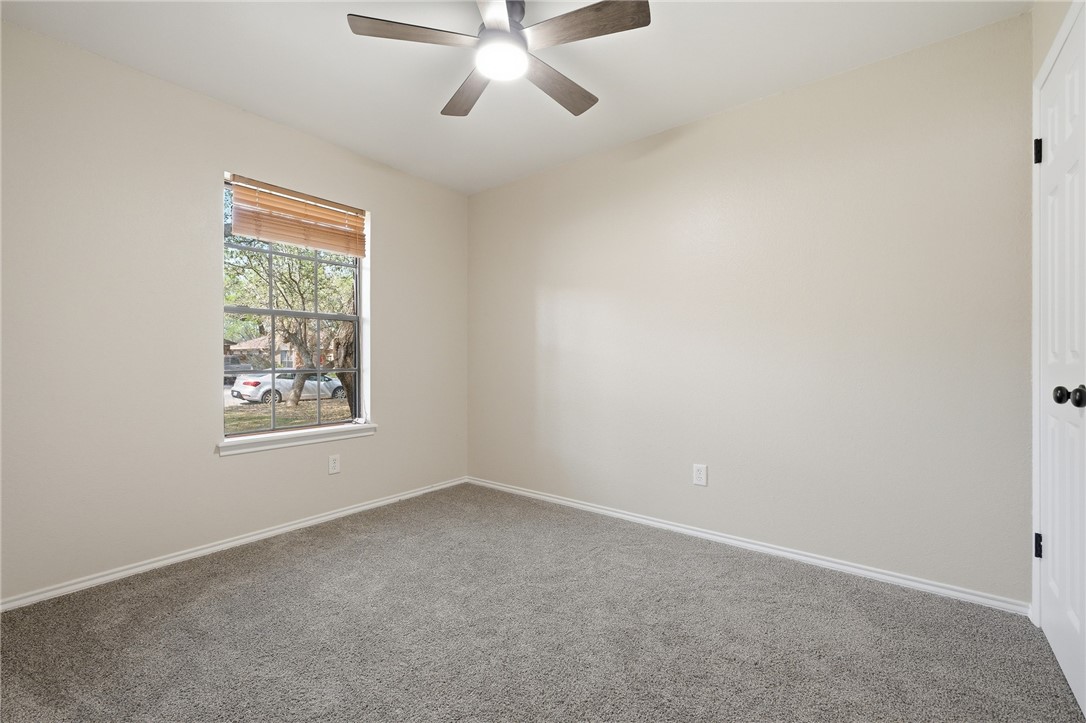 2169 Timberleaf Circle Ingleside, TX 78362 - Photo 20 of 36 an empty room with a window and a fan