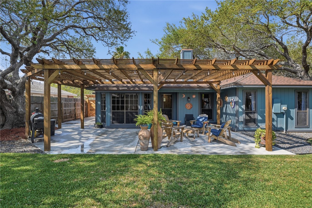 2169 Timberleaf Circle Ingleside, TX 78362 - Photo 32 of 36 a view of a house with backyard porch and sitting area