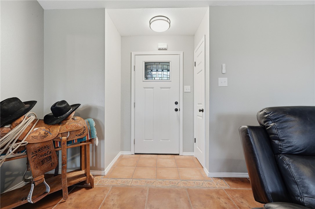 2169 Timberleaf Circle Ingleside, TX 78362 - Photo 5 of 36 a bed room with a bed and a chair