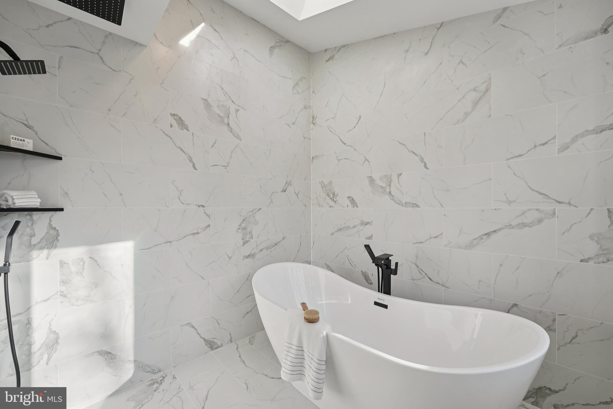 2839 Garwood Road Sicklerville, NJ 08081 - Photo 13 of 23 a white bath tub sitting in a bathroom