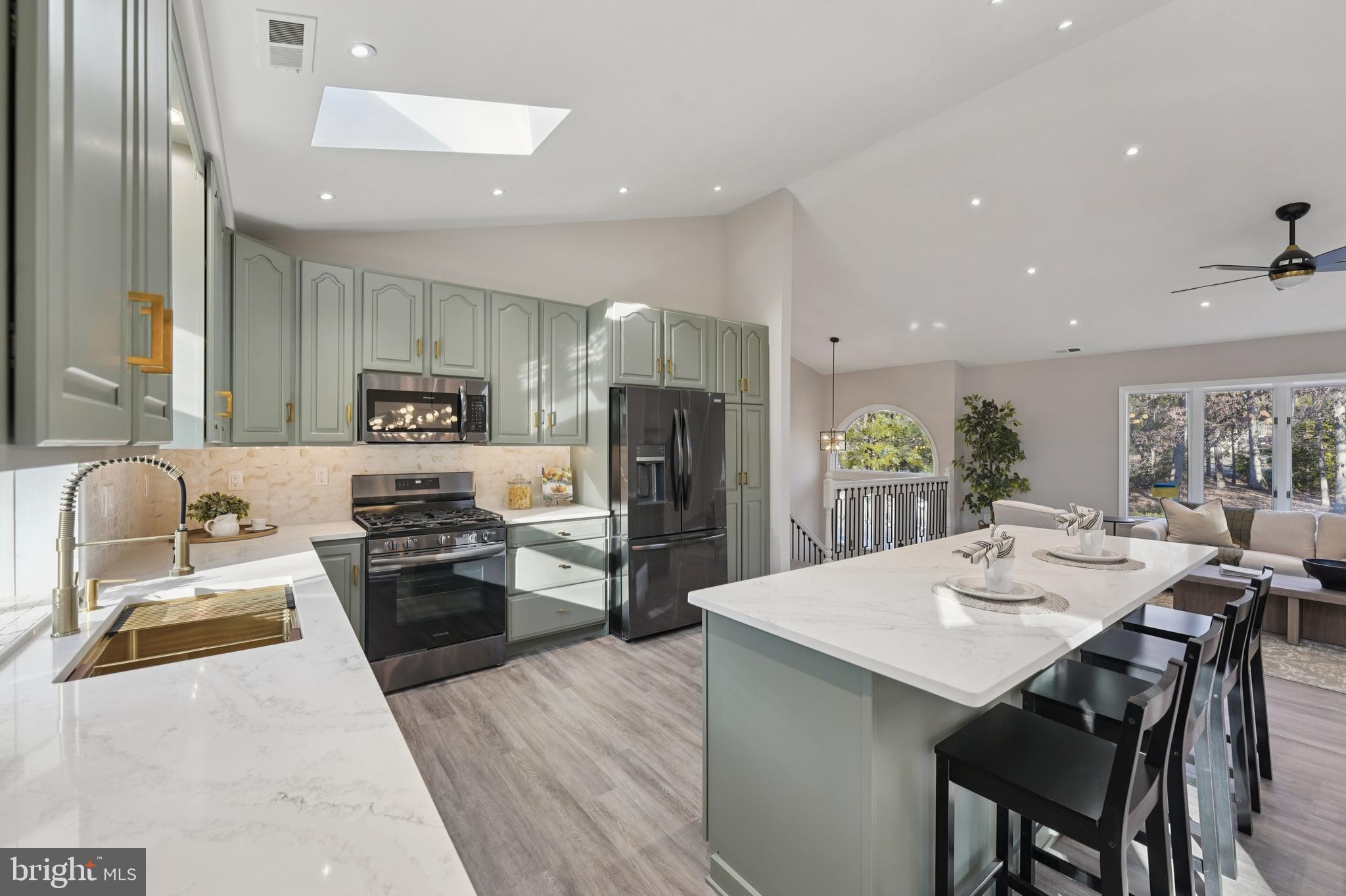 2839 Garwood Road Sicklerville, NJ 08081 - Photo 9 of 23 a kitchen with stainless steel appliances a stove a sink a refrigerator and chairs