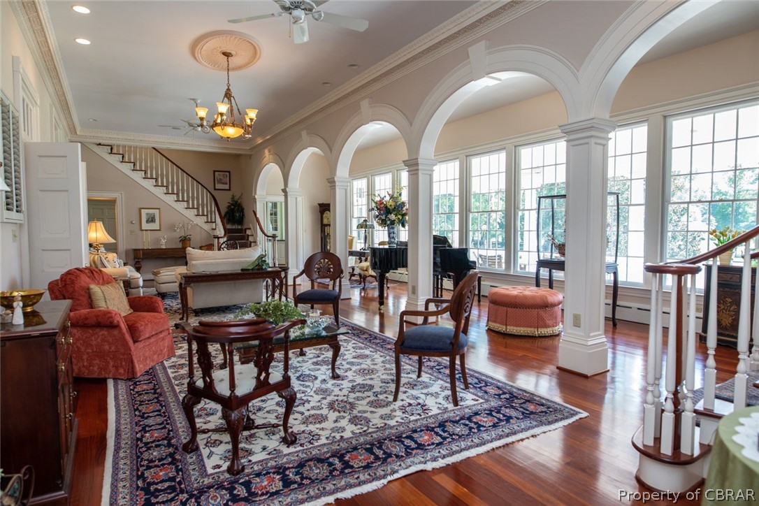 19607 White Oak Road Sutherland, VA 23885 - Photo 14 of 50 Living room. Five arches with windows overlooking the balcony. Ornate crown molding and symmetrical matched staircases.