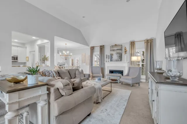 a living room with furniture wooden floor and a fireplace