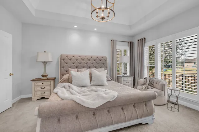 a bedroom with a bed and a table