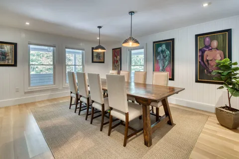 a view of a dining room with furniture window and outside view