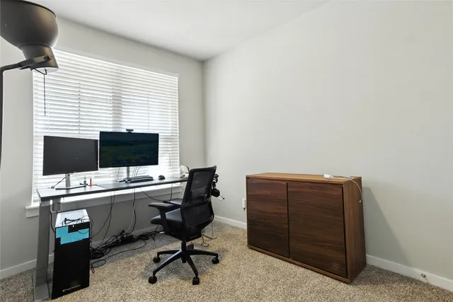a kitchen with sink a microwave and cabinets