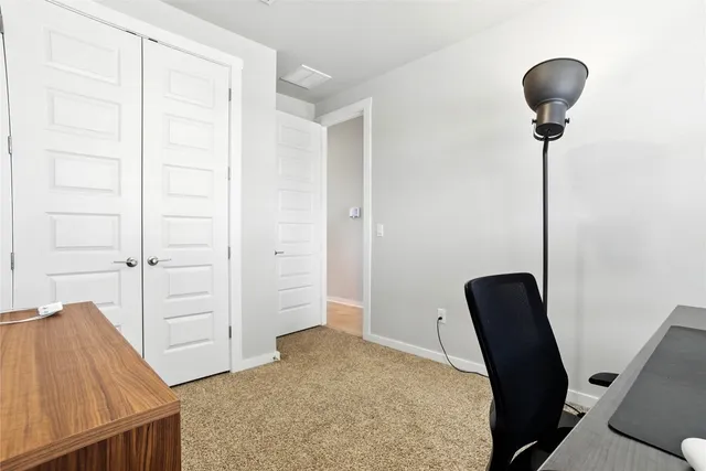 a kitchen with a stove a sink and a microwave