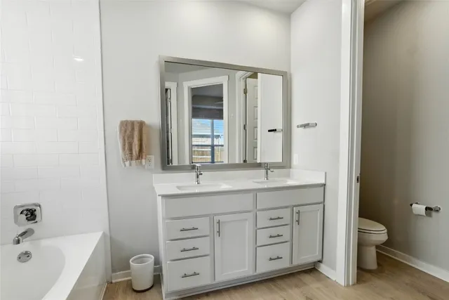 a view of walk in closet with living room