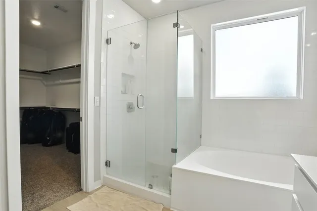 a bathroom with a granite countertop sink a toilet and a bathtub