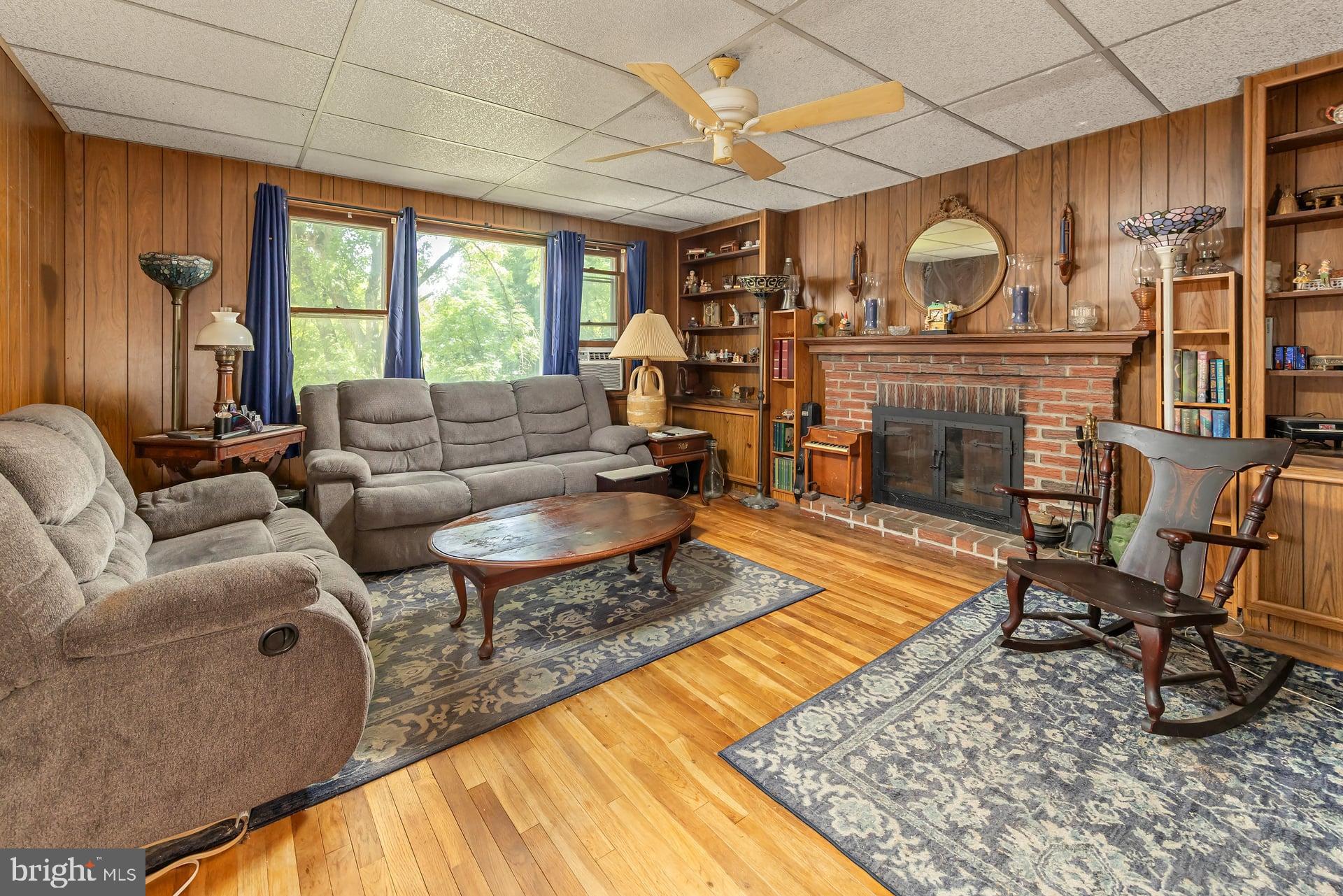 401 West Avenue Delanco, NJ 08075 - Photo 3 of 19 a living room with furniture a fireplace and a table