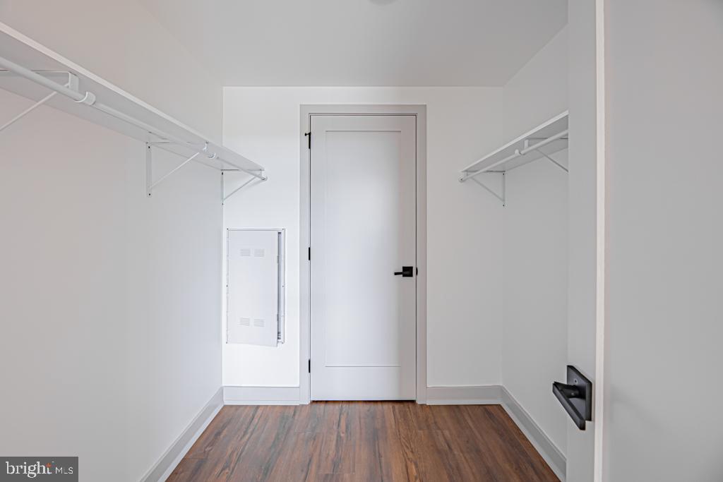 5001 Umbria Street, Unit U310 Philadelphia, PA 19128 - Photo 8 of 10 a view of room with walk in closet and wooden floor