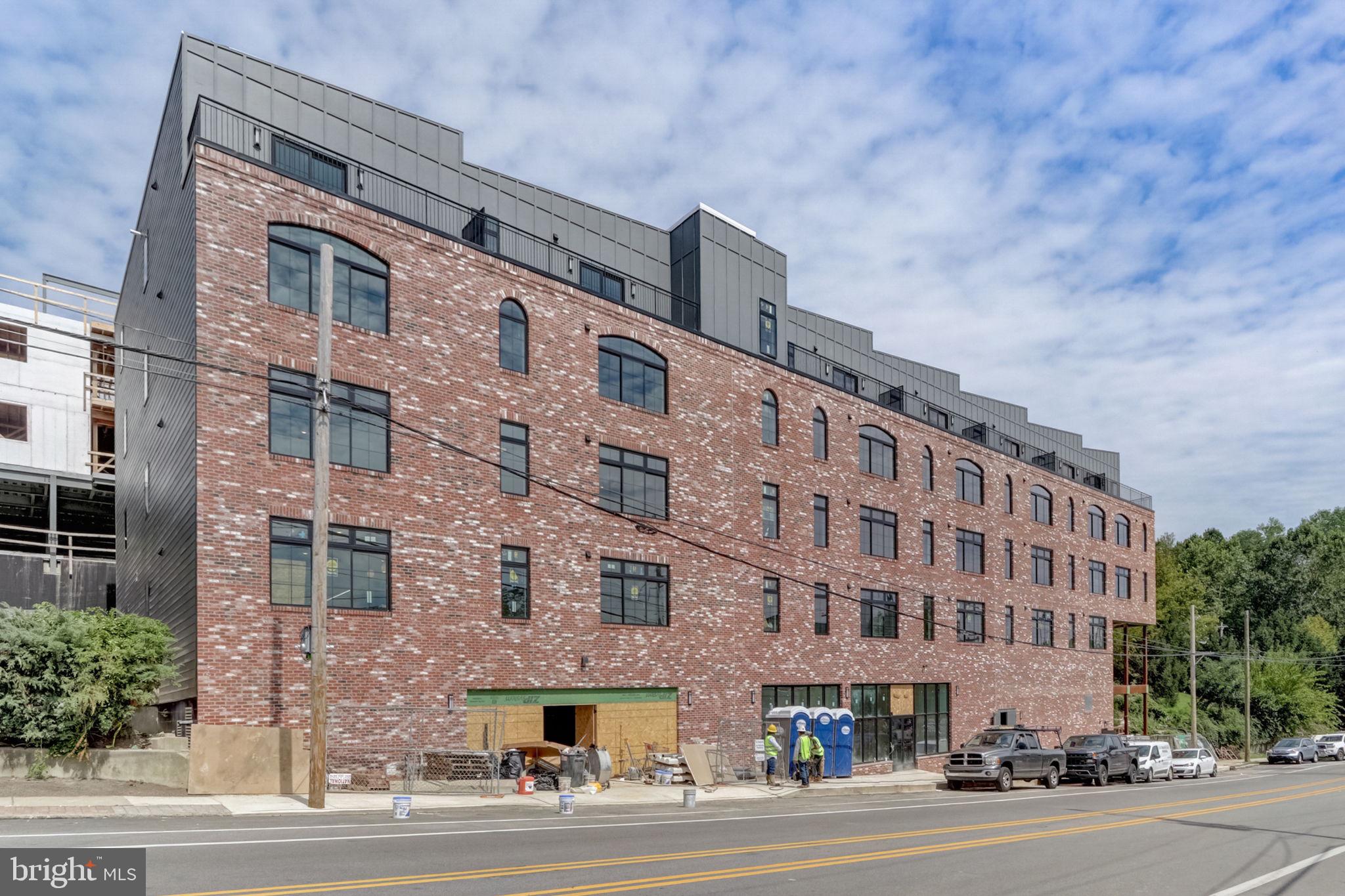 5001 Umbria Street, Unit U310 Philadelphia, PA 19128 - Photo 10 of 10 a view of a building and a street