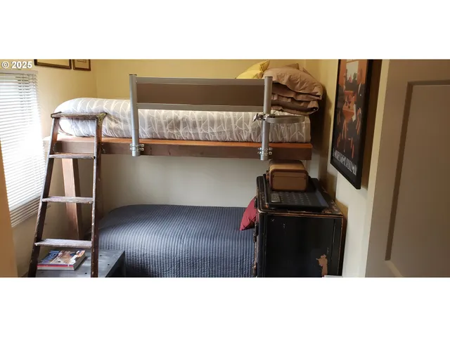 a view of a house with a backyard and a tub