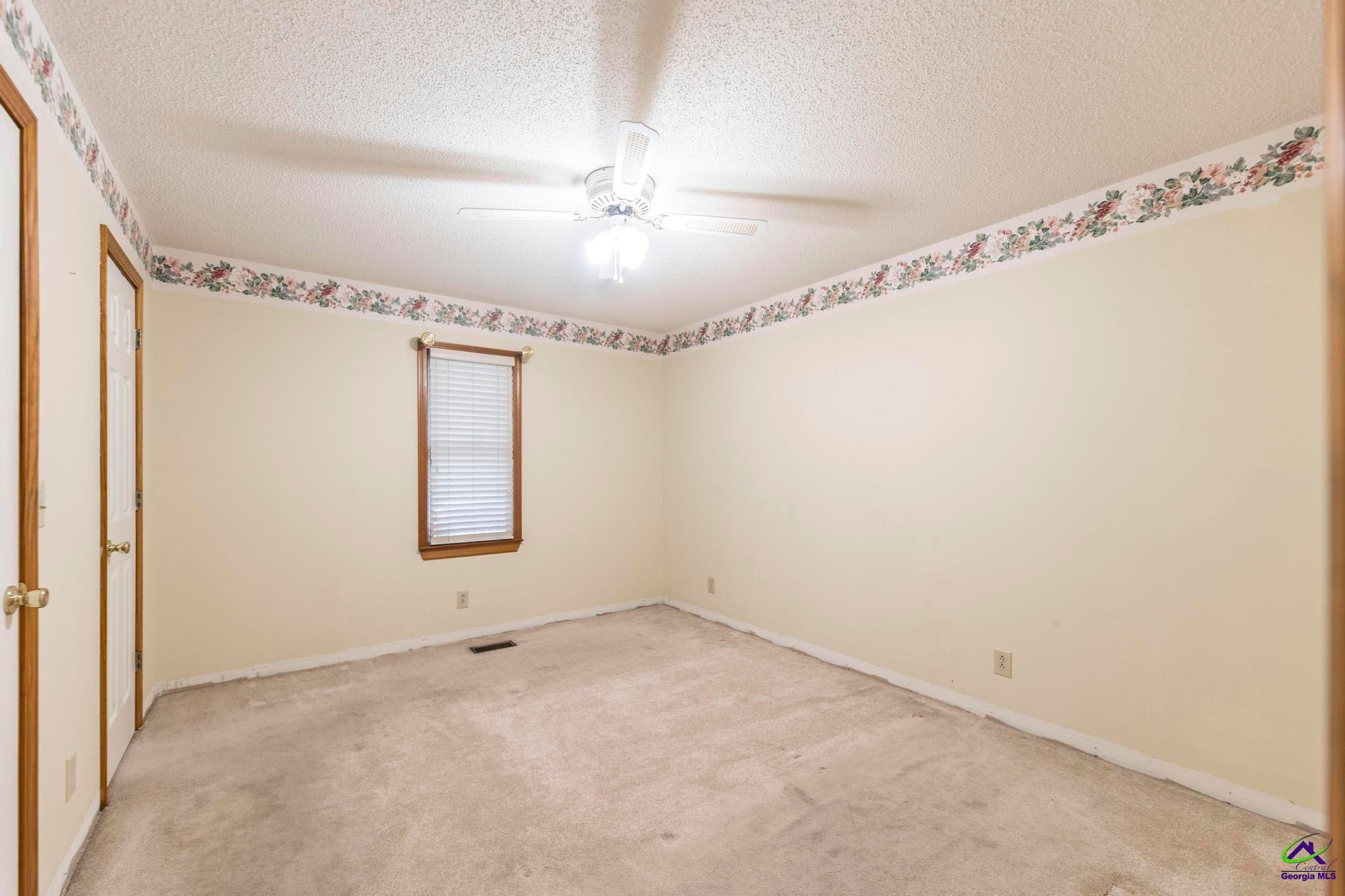 5731 School Road Macon, GA 31216 - Photo 24 of 33 Large bedrooms offer flexibility for family, guests, or hobbies.