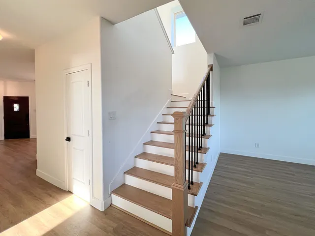 a view of entryway with wooden floor