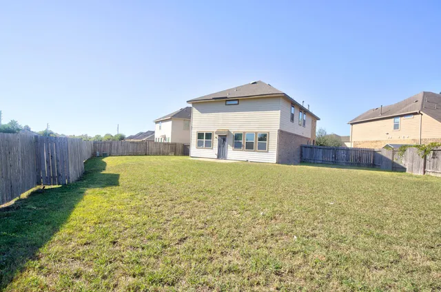 a big yard with large trees