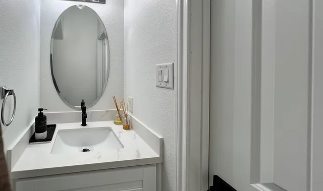 a bathroom with a sink and a mirror