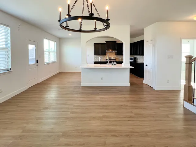 a view of kitchen and kitchen with sink