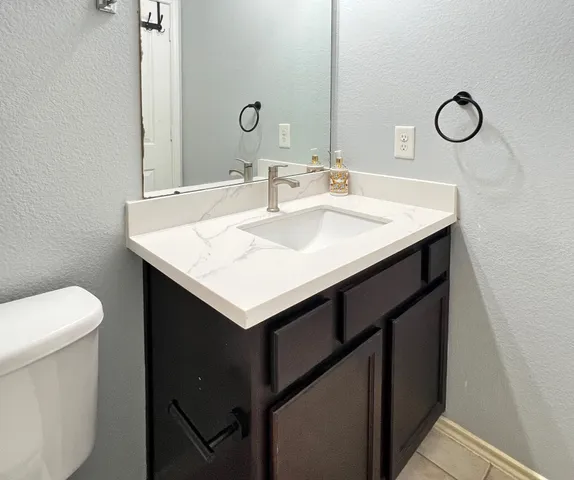 a bathroom with a sink and a toilet